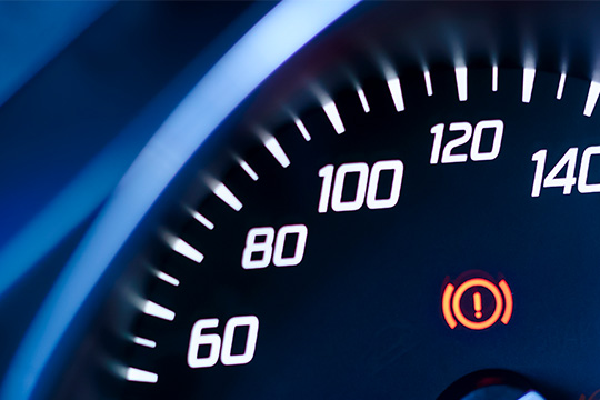 brake warning light on car dashboard