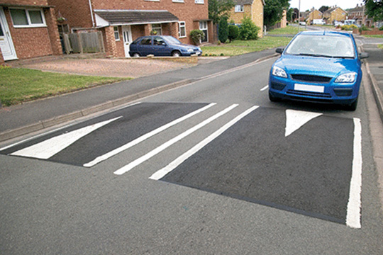 car approaching road hump