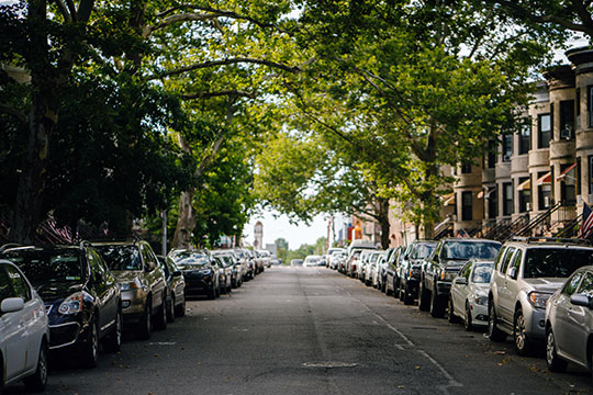 cars parked both side on hill