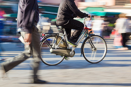 cyclists and pedestrians crossing road together