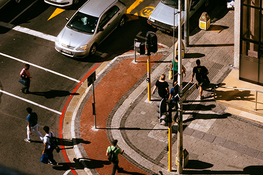 pedestrians crossing at busy junction
