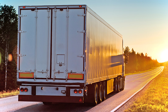 truck on the road in the evening