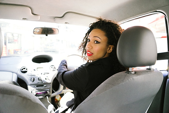 young lady reversing in car