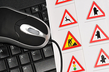 mouse on keyboard and road traffic signs mock up