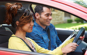 young woman driver having driving lessons