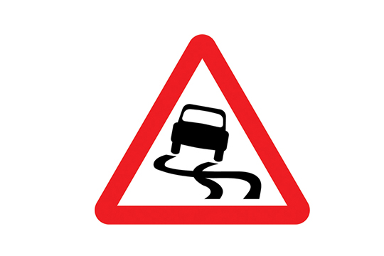 slippery road sign