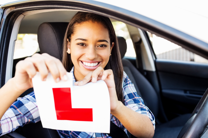 Newly qualified driver with their car
