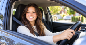 New driver sitting behind the wheel of a car